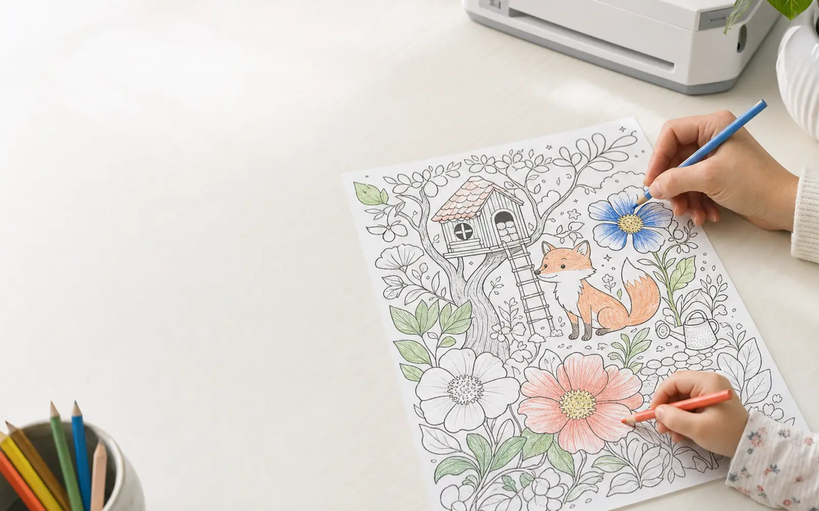 ColorKind coloring page being colored at a table near a home printer